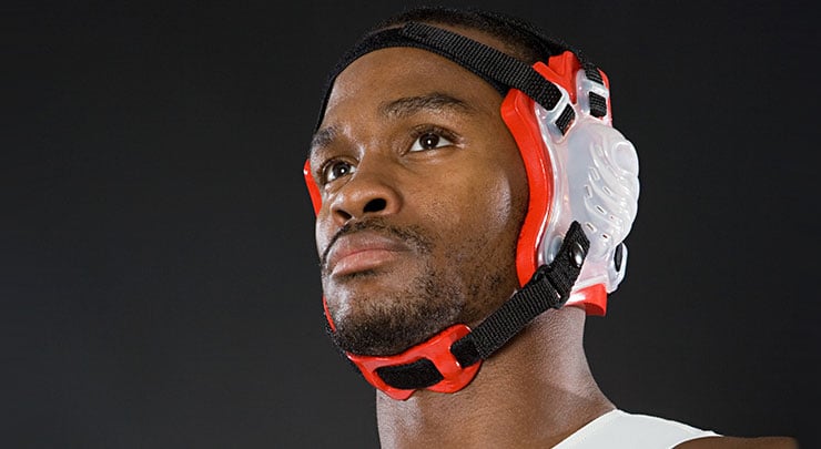 Wrestler wearing ear protection.