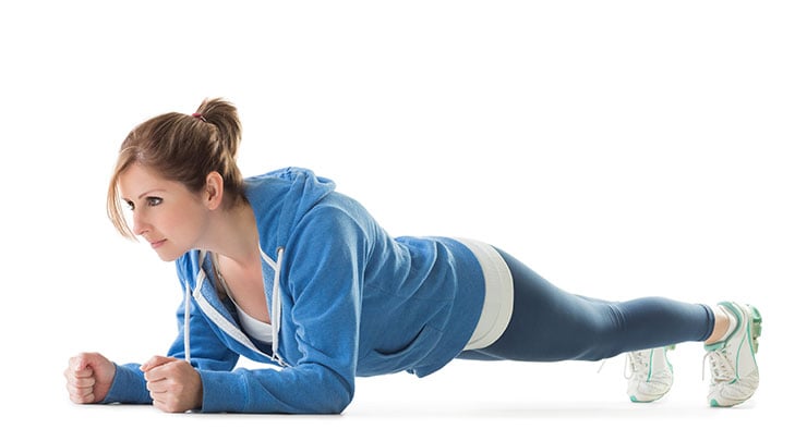 Woman doing plank exercise.