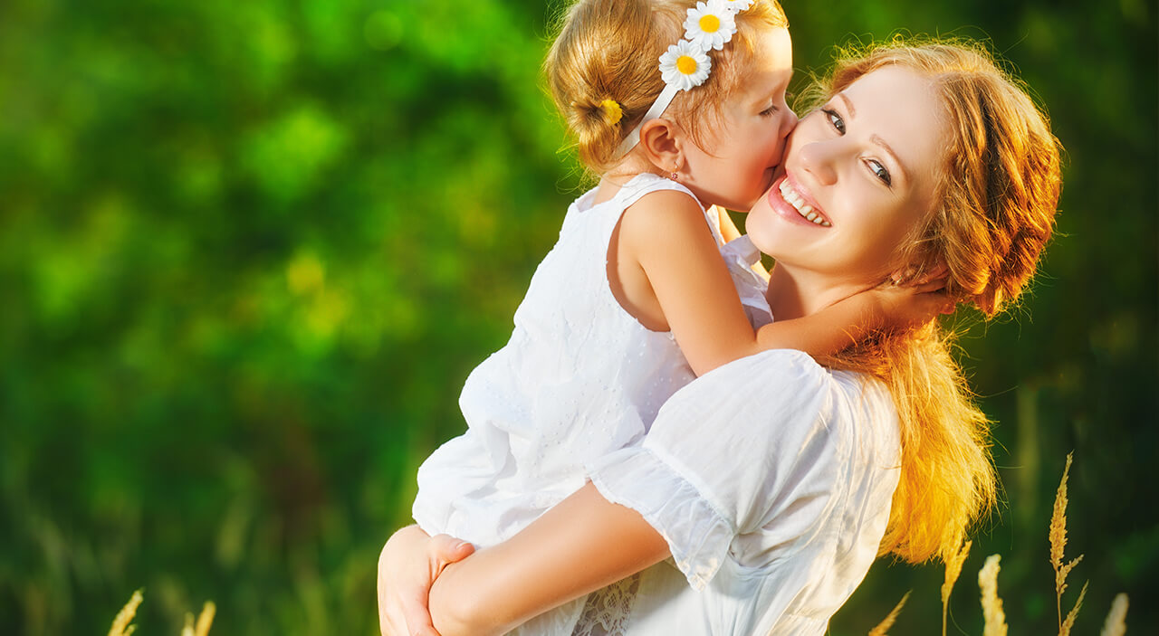 Woman with daughter in field