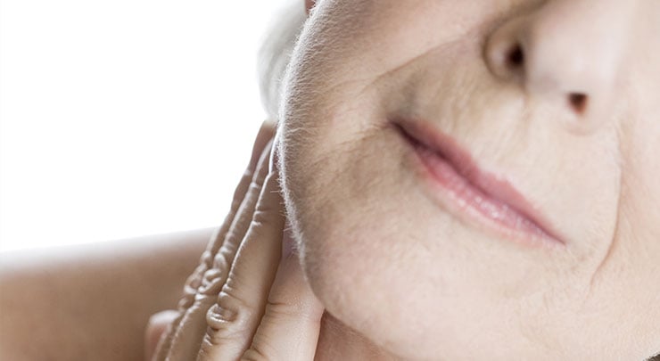 Closeup of older woman's nasolabial folds.